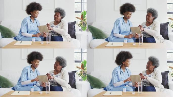 非裔美国女医生和高级女性说话和使用平板电脑