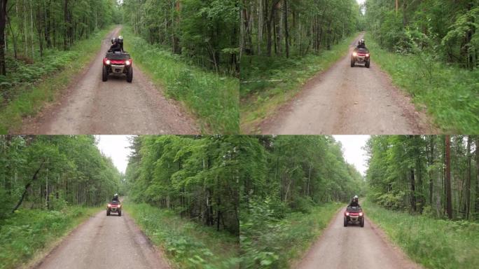 在森林中驾驶四轮摩托的人
