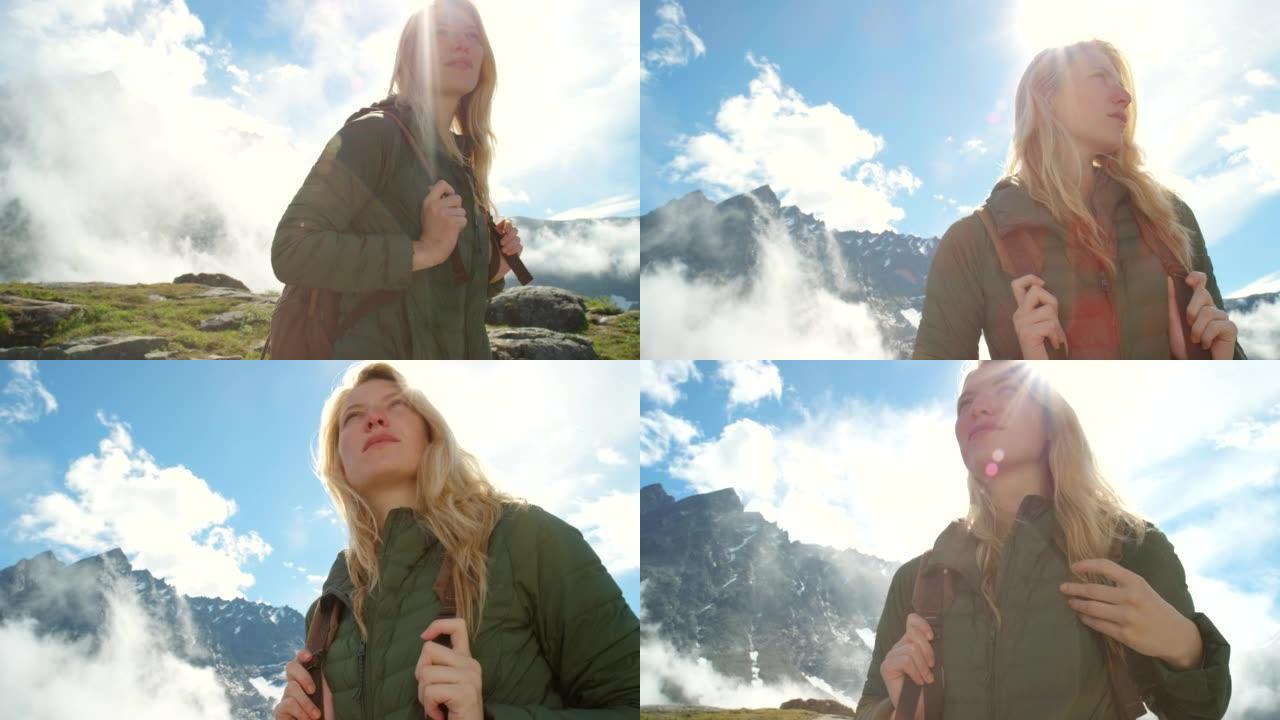 4k视频片段，一个迷人的女人在m ø re og Romsdal远足时欣赏山景