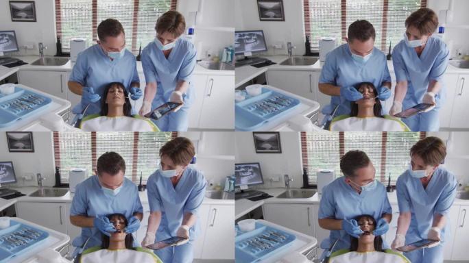 在现代牙科诊所用口罩检查女性患者牙齿的高加索男性牙医