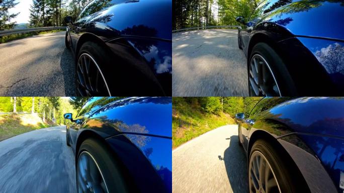 田园诗般的汽车在空旷的蜿蜒山路上骑行，周围是林地，轮胎旋转