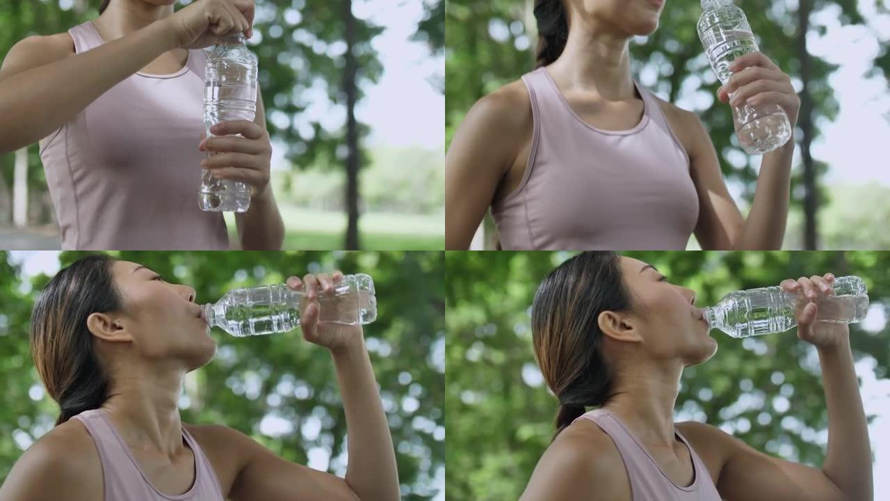 亚洲妇女跑步后喝水