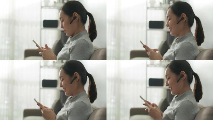 亚洲妇女使用智能手机进行通讯视频通话