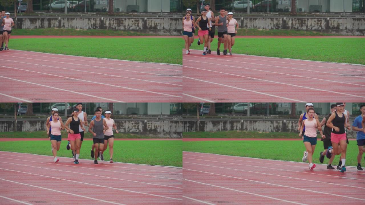 亚洲中华运动员队在下雨天气在田径场跑