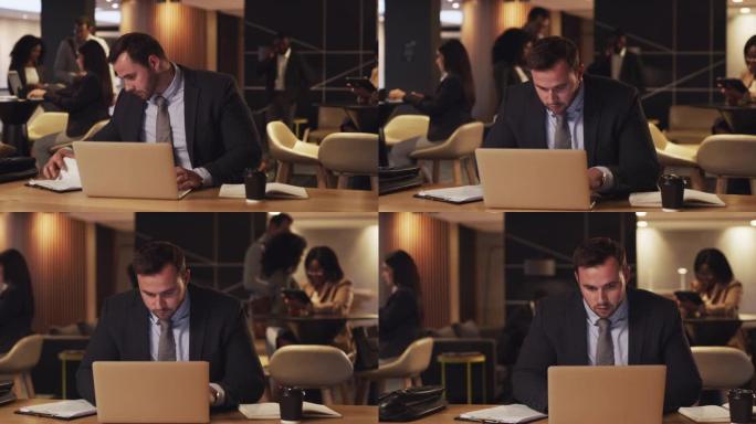 4k视频片段，一名年轻商人在会议室的笔记本电脑上工作