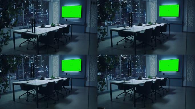 现代化的空会议室，有大会议桌，上面放着各种文件和笔记本电脑。墙壁电视显示绿色色度键屏幕模拟显示模板。