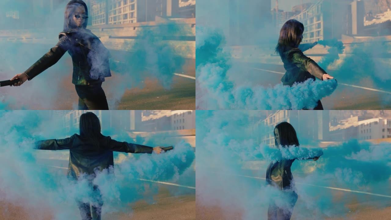 女孩在城市与蓝色烟雾手榴弹跳舞年轻叛逆的女人庆祝街头慢动作舞蹈的创造性表达