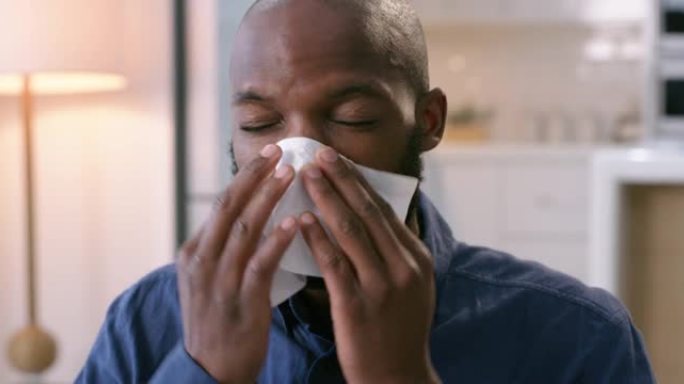 一个年轻人因感冒而吹鼻子的4k视频片段