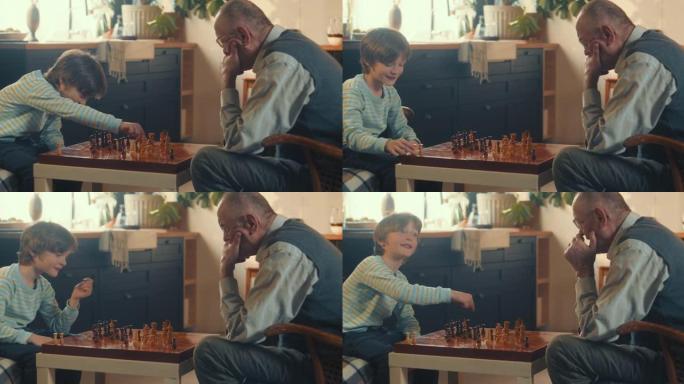 可爱的孩子男孩做出聪明的动作微笑着在家里与70多岁的老爷爷下棋。情报概念