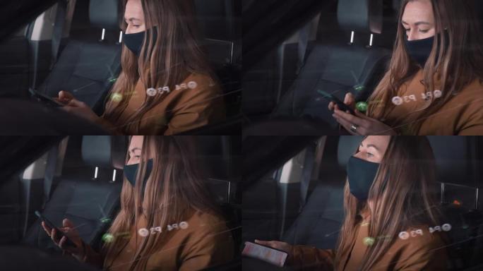用智能手机在停车场的汽车驾驶员座位上工作的特写年轻严肃漂亮的女商人戴着口罩。