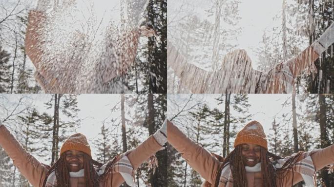 女孩向空中扔雪非裔黑人玩雪玩耍打雪仗