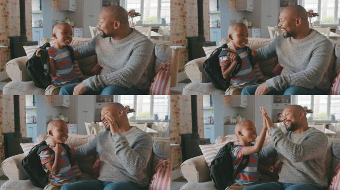 一个英俊的成熟男人放学回家后向儿子打招呼的4k视频片段