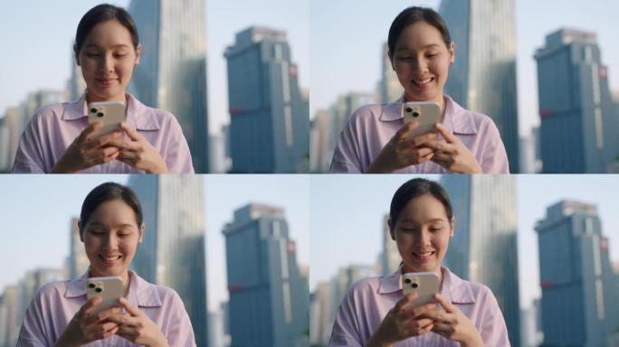亚洲女商人在城市使用智能手机