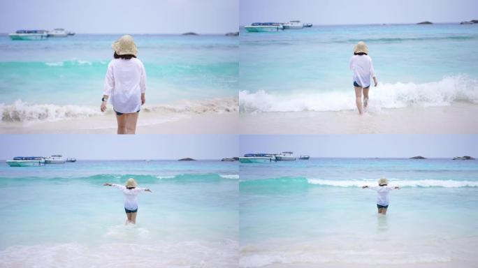 女人在暑假的海滩上幸福