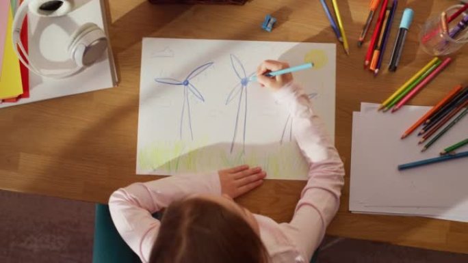 Top View: Little Girl Drawing Beautiful Wind Turbi