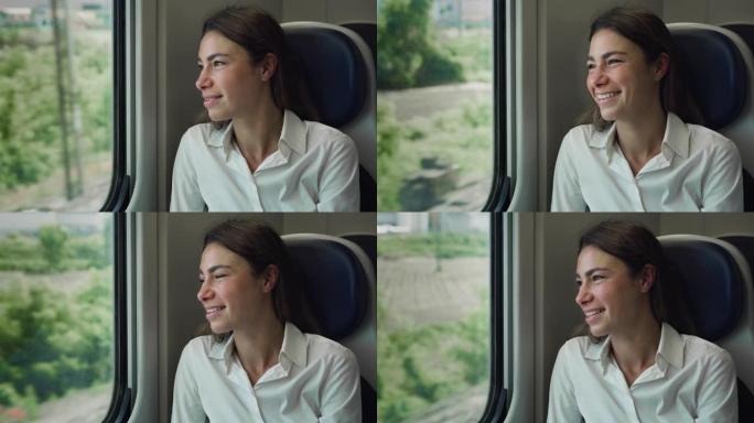 年轻女子乘火车穿越绿色景观时透过窗户看的电影镜头。到达郊区后，快乐的女性微笑着，对新的机会感到兴奋