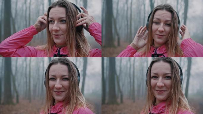 快乐女人在森林戴上耳机