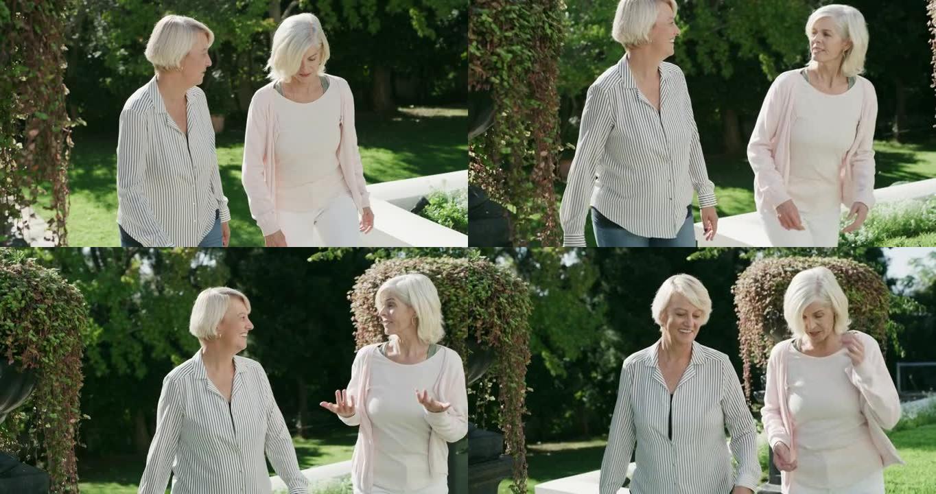 两个成熟朋友在花园里散步的4k视频片段