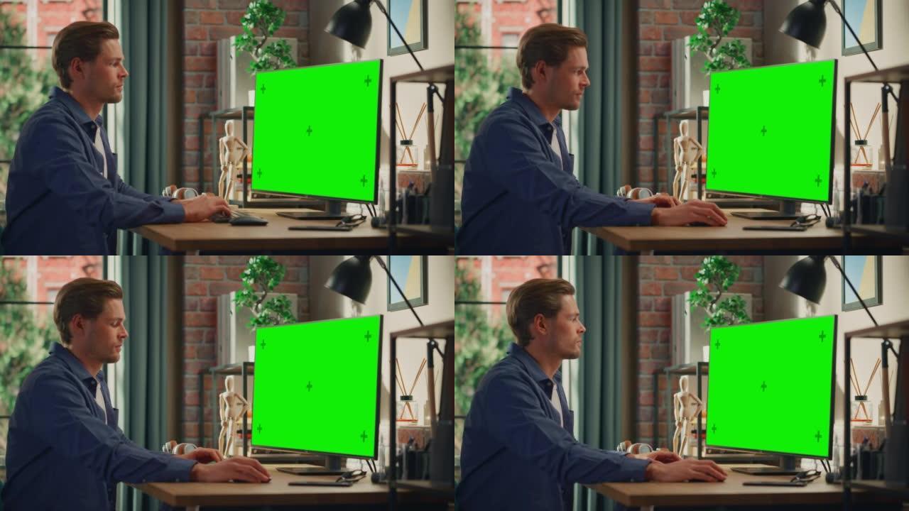 年轻英俊的男人在家工作，在带有绿屏模拟显示的台式计算机上。男性检查公司账户，给同事发信息。带大窗户的
