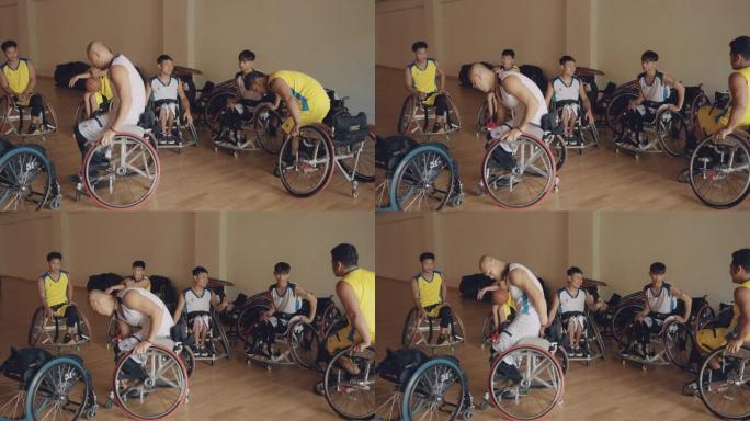 男运动员为篮球比赛准备运动轮椅。