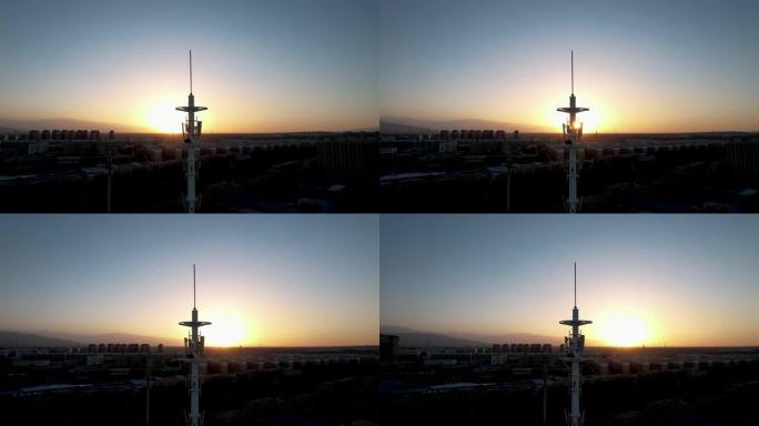 日落时5g蜂窝通信塔的鸟瞰图