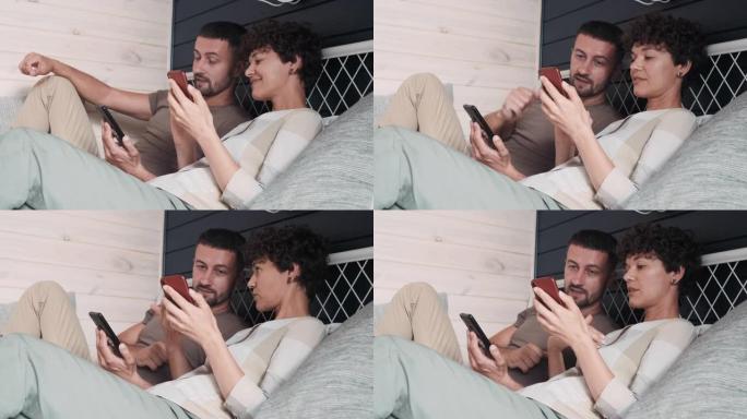 男女在床上使用手机