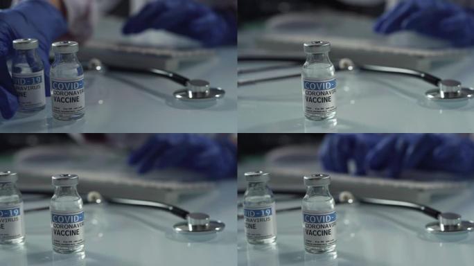 男医生或护士在医院为患者控制冠状病毒疫苗的抗体的电影微缩镜头。covid-19概念、防护、病毒传播、