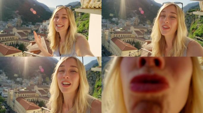 4k视频片段，一名年轻女子在度假时从意大利的公寓阳台打视频电话