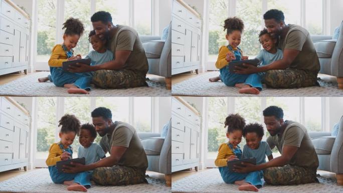 军装父亲回家休假，孩子们坐在地毯上玩平板电脑——慢镜头拍摄