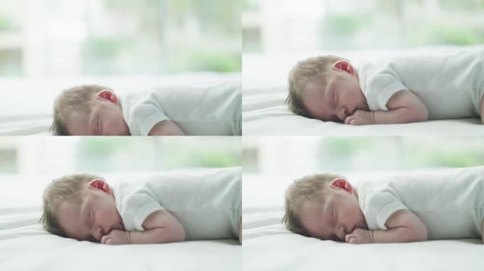 婴儿在睡梦中微笑，因为他们在听天使的低语