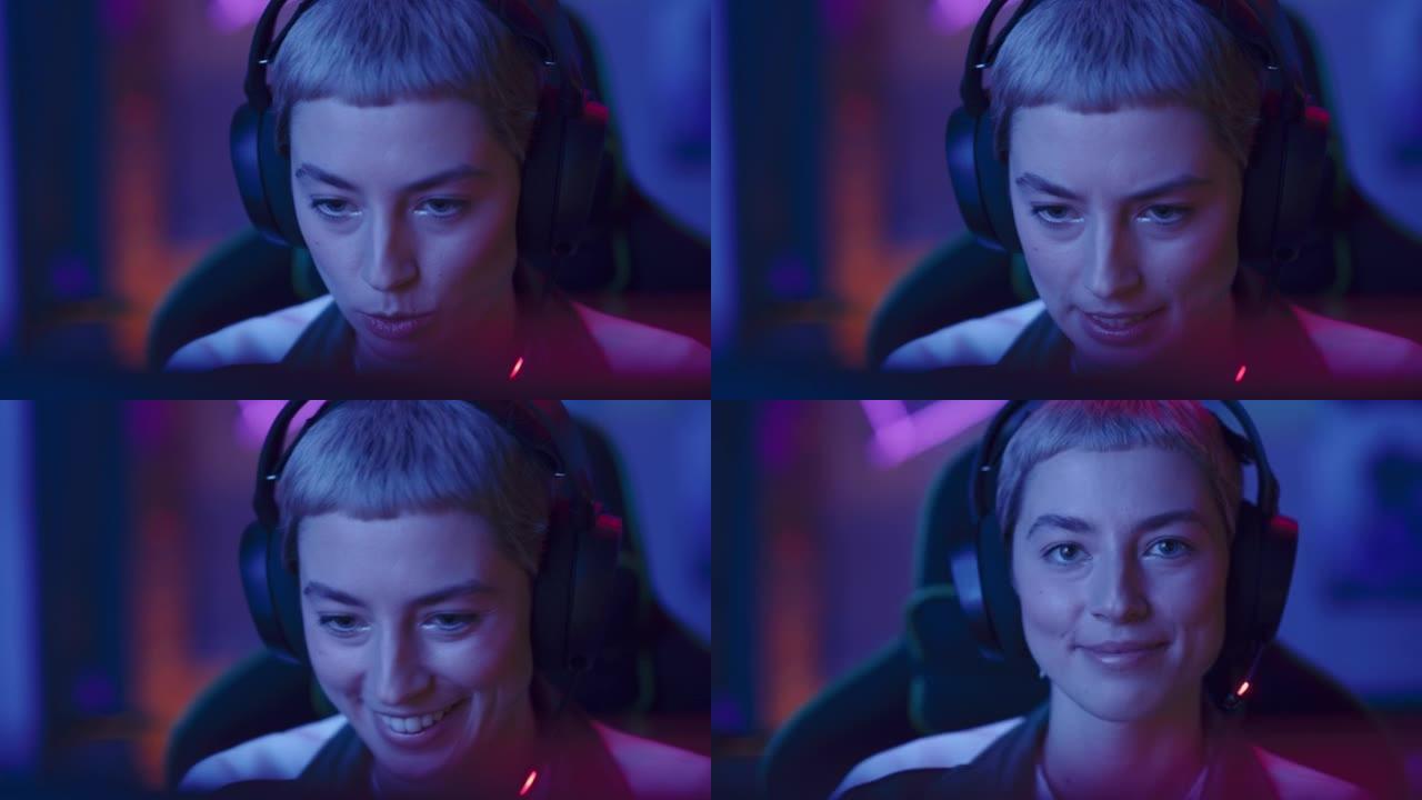 一个女性玩家在电脑上玩在线视频游戏的肖像。戴着耳机的时尚女性的特写镜头，享受休闲时光，微笑着摆姿势拍