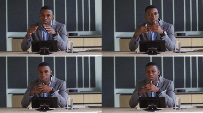 非裔美国商人在现代办公室会议室进行视频通话