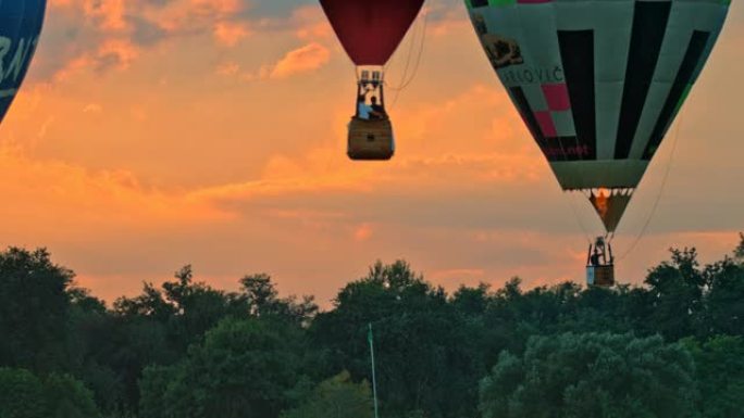 日出时的超级慢动作漂浮热气球