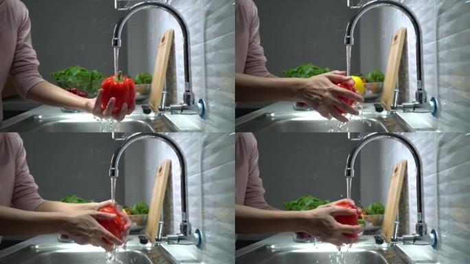 女人手洗蔬菜