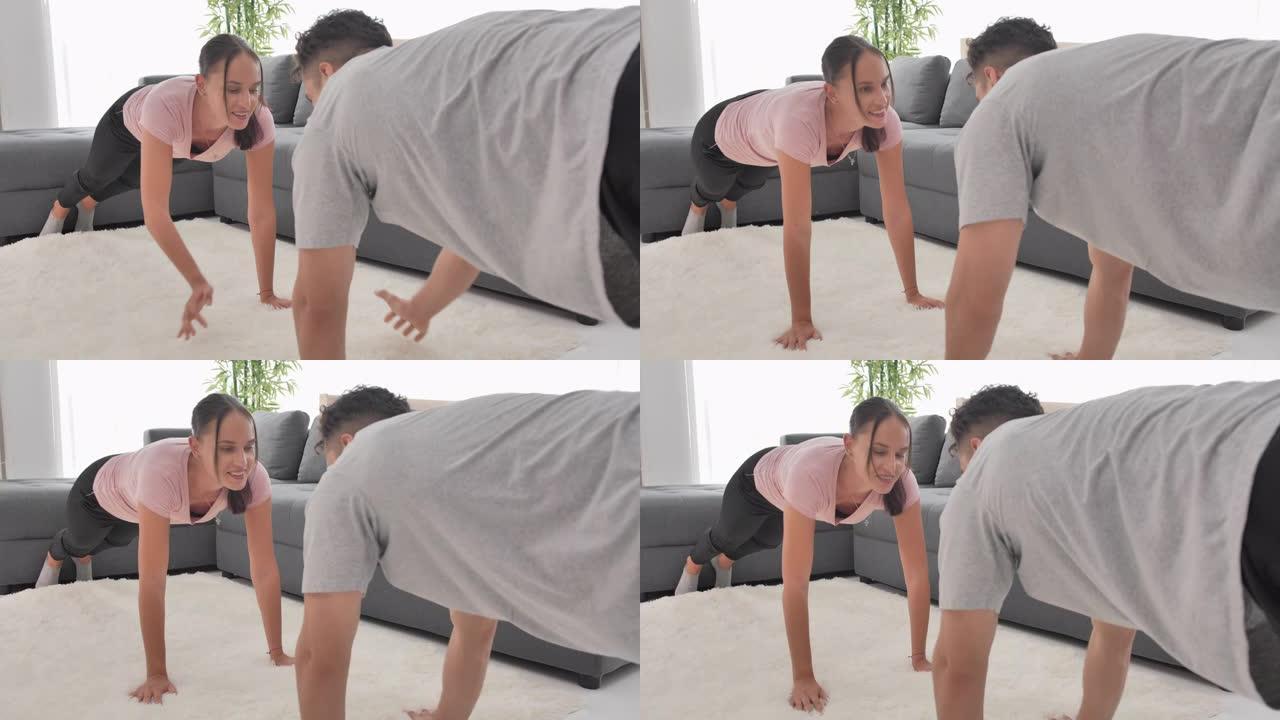 开朗的高加索夫妇伸展肌肉，在家训练。