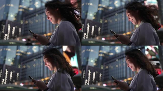 亚洲女商人晚上使用智能手机