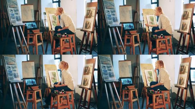 一位女士正在艺术工作室在线学习绘画