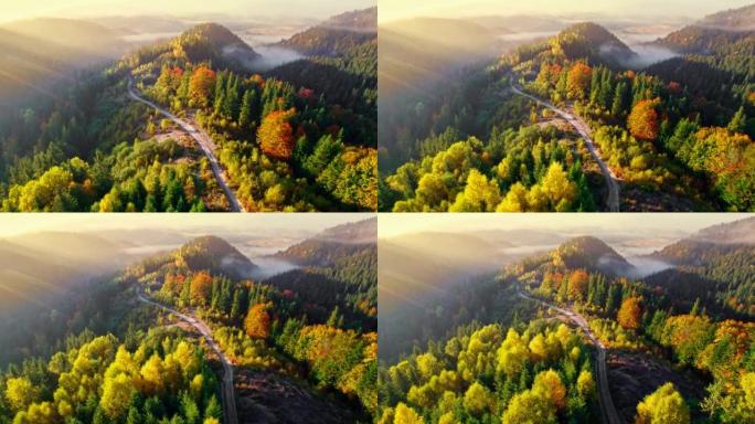 多姿多彩的秋天在山里。鸟瞰图的晨雾秋山有黄色和红色的树木。UHD, 4K
