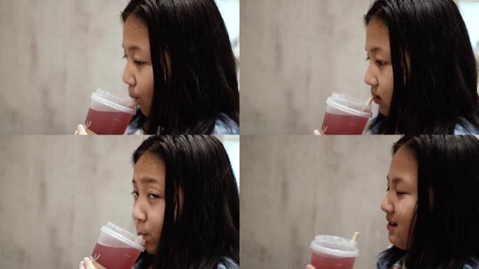 亚洲女孩喝健康维生素果汁