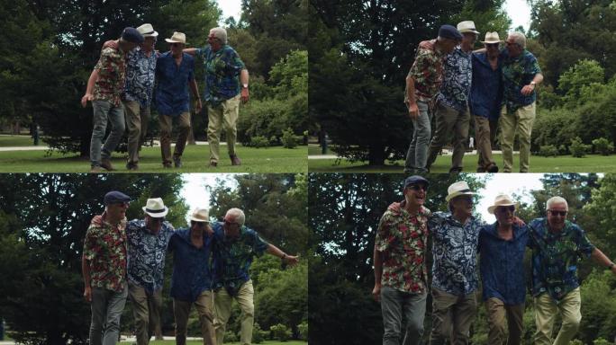 穿着夏威夷衬衫的快乐资深朋友在公园里一起玩乐的肖像。一群老人在度假，拥抱，散步，大笑。他们正在庆祝他