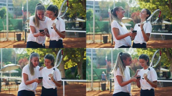 年轻女性青少年网球运动员的真实照片朋友们在阳光明媚的日子里，在球场上进行友谊赛或训练锻炼游戏后，使用