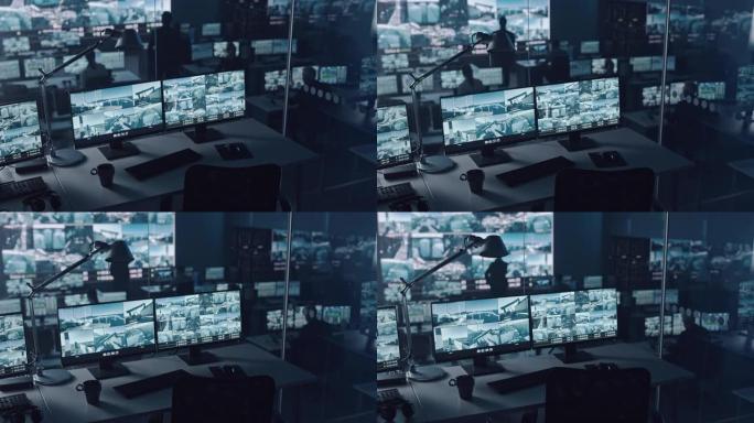 港口监控中心的两个数字计算机屏幕，带有监控闭路电视视频录像，大屏幕上有多个摄像头。员工坐在大数据显示