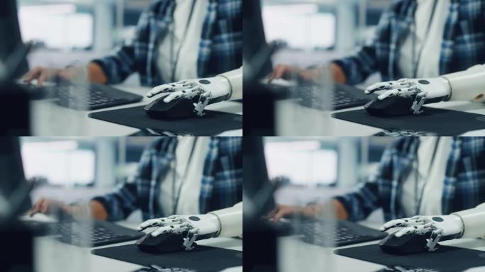 包容性办公室: 残疾人使用假肢在计算机上工作。专业具有先进的思想控制身体动力肌电仿生肢体控制小鼠。专