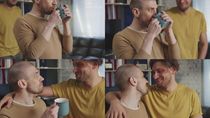 男子喝咖啡被男伴侣拥抱