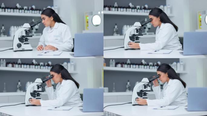 实验室科学家使用显微镜检查病毒。生物化学家工程师寻找突破性的治疗与医学研究和书写发现与手持相机运动的