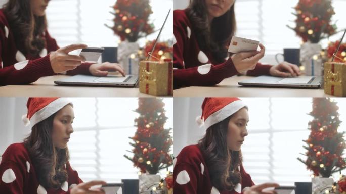 圣诞节期间使用智能手机和卡片在线购买的特写手女人