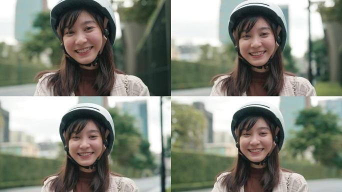 亚洲女商人驾驶踏板车可再生能源运输的肖像。