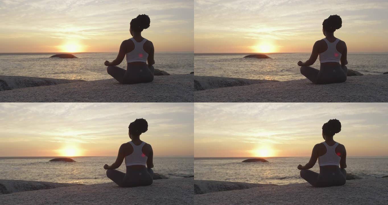 4k后视录像，一名年轻女子在海滩上练习深度冥想