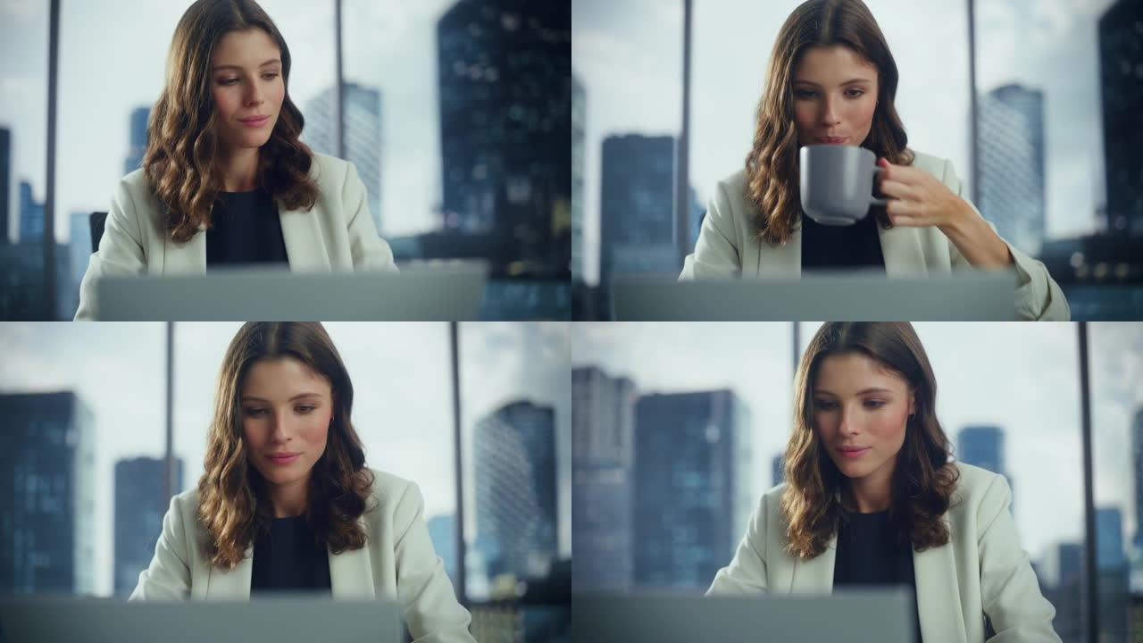 成功的年轻女商人坐在办公桌前在大城市办公室的笔记本电脑上工作的肖像。美丽的社交媒体战略经理计划颠覆性