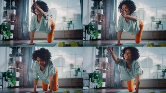 美丽的黑人女孩在家健身，早上伸展双腿。真正的女人在做锻炼，在垫子上做瑜伽练习。健康健康自信的女性。慢